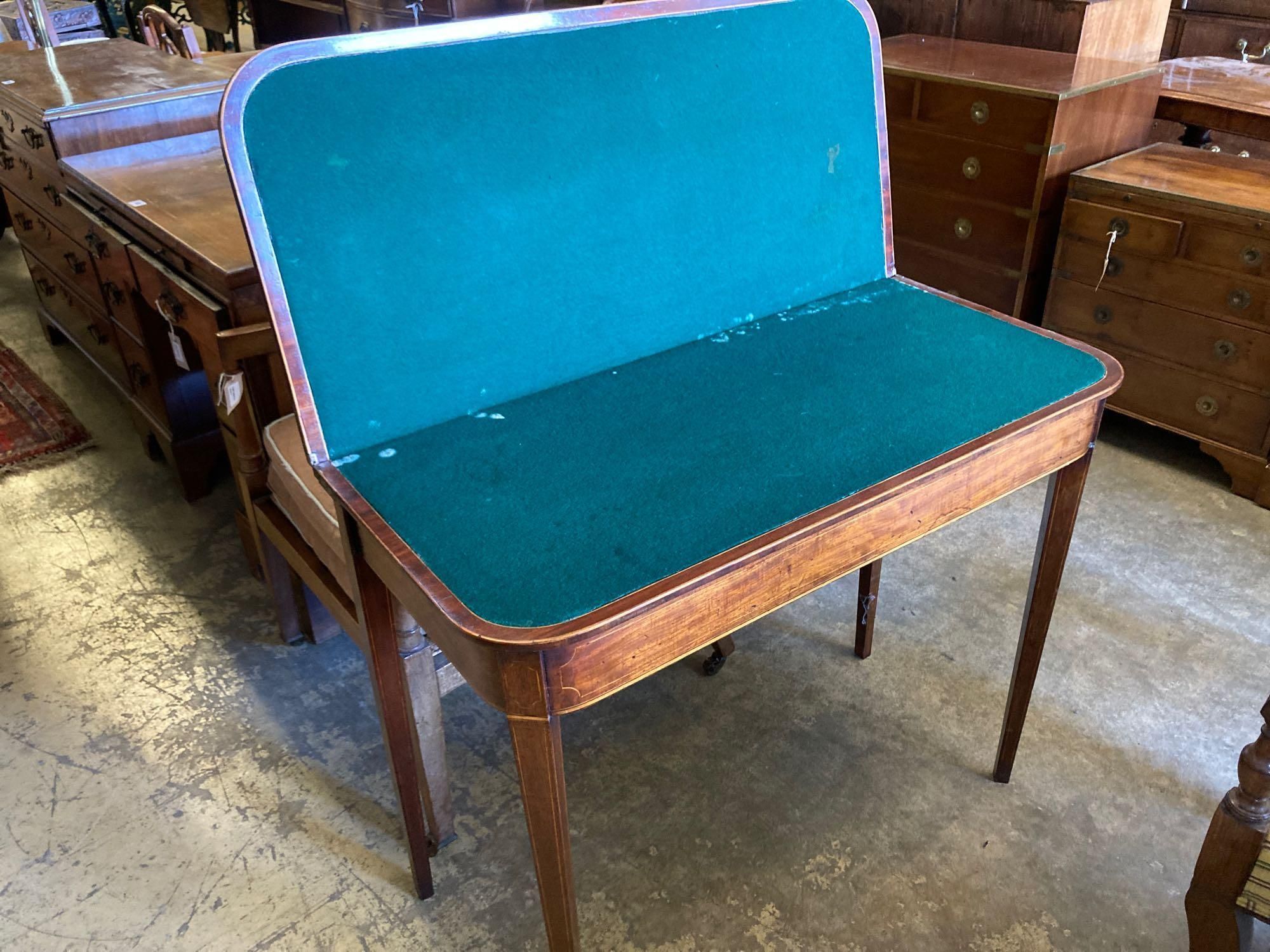 A late George III inlaid mahogany folding card table, width 91cm